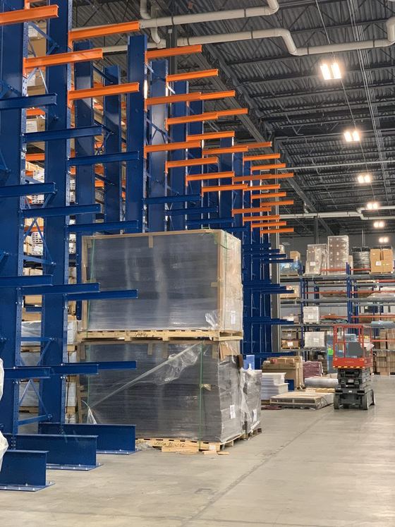 Cantilever racking with crated product staged in a warehouse