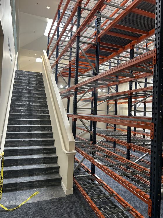Multi-level rack supported pick module with stairs and wire decking