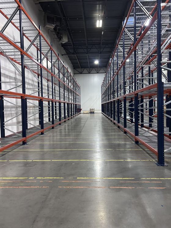 A long pallet rack aisle installed by AIS